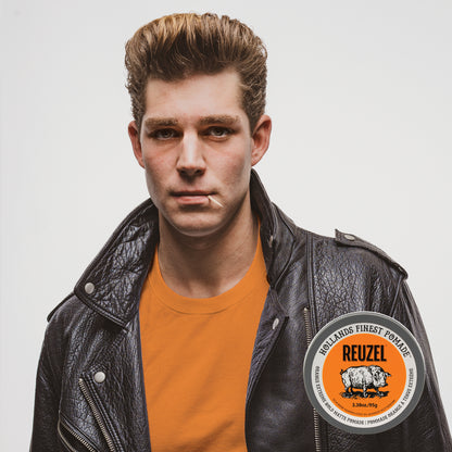Reuzel Orange Extreme Hold Matte Pomade jar with orange label and black lid, showcasing the product for strong, matte hairstyle hold.