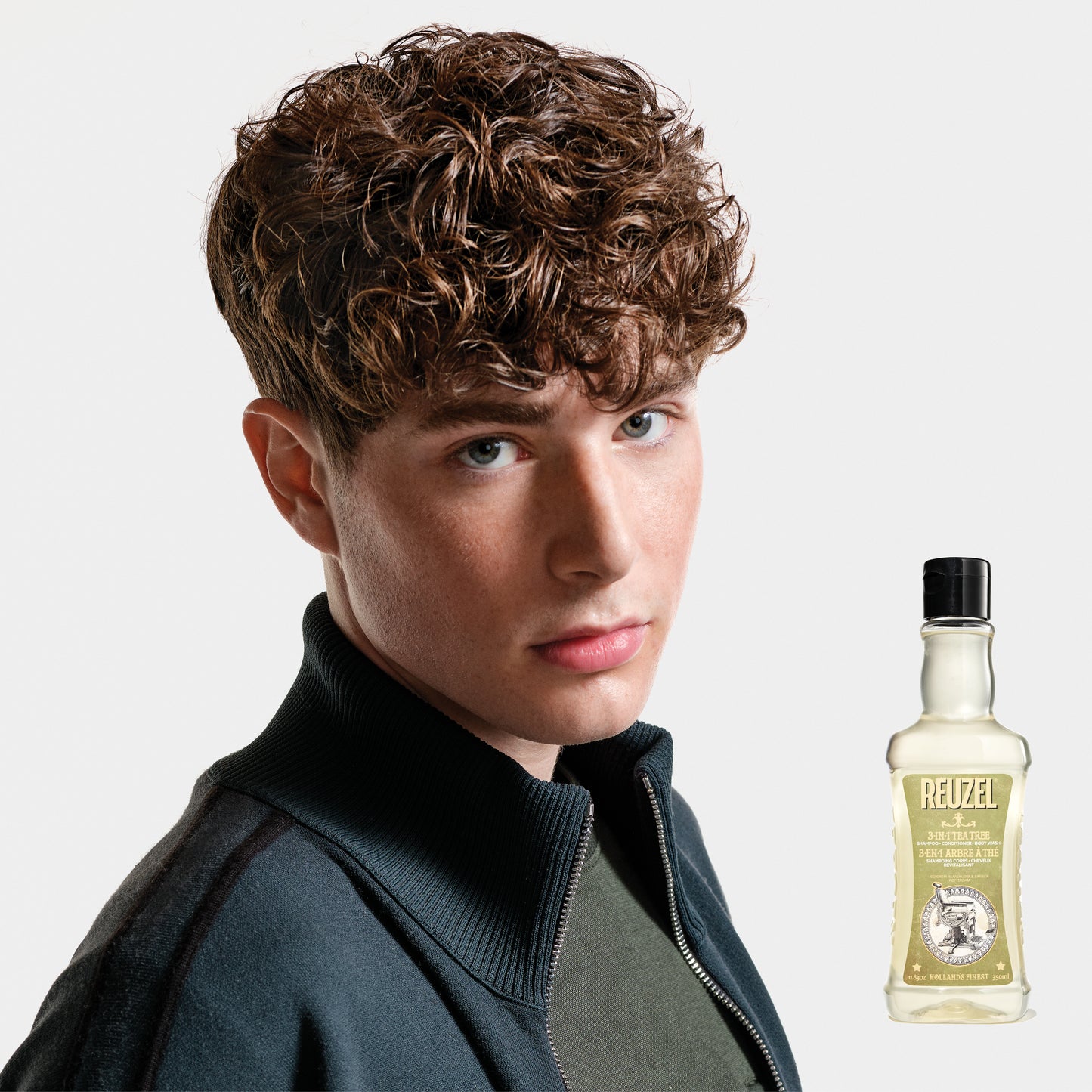 Reuzel Road Trip To Go 3-in-1 Tea Tree Shampoo, Conditioner, and Body Wash bottle with label visible