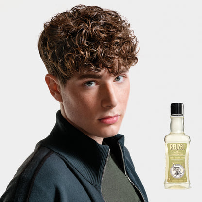 Reuzel Road Trip To Go 3-in-1 Tea Tree Shampoo, Conditioner, and Body Wash bottle with label visible