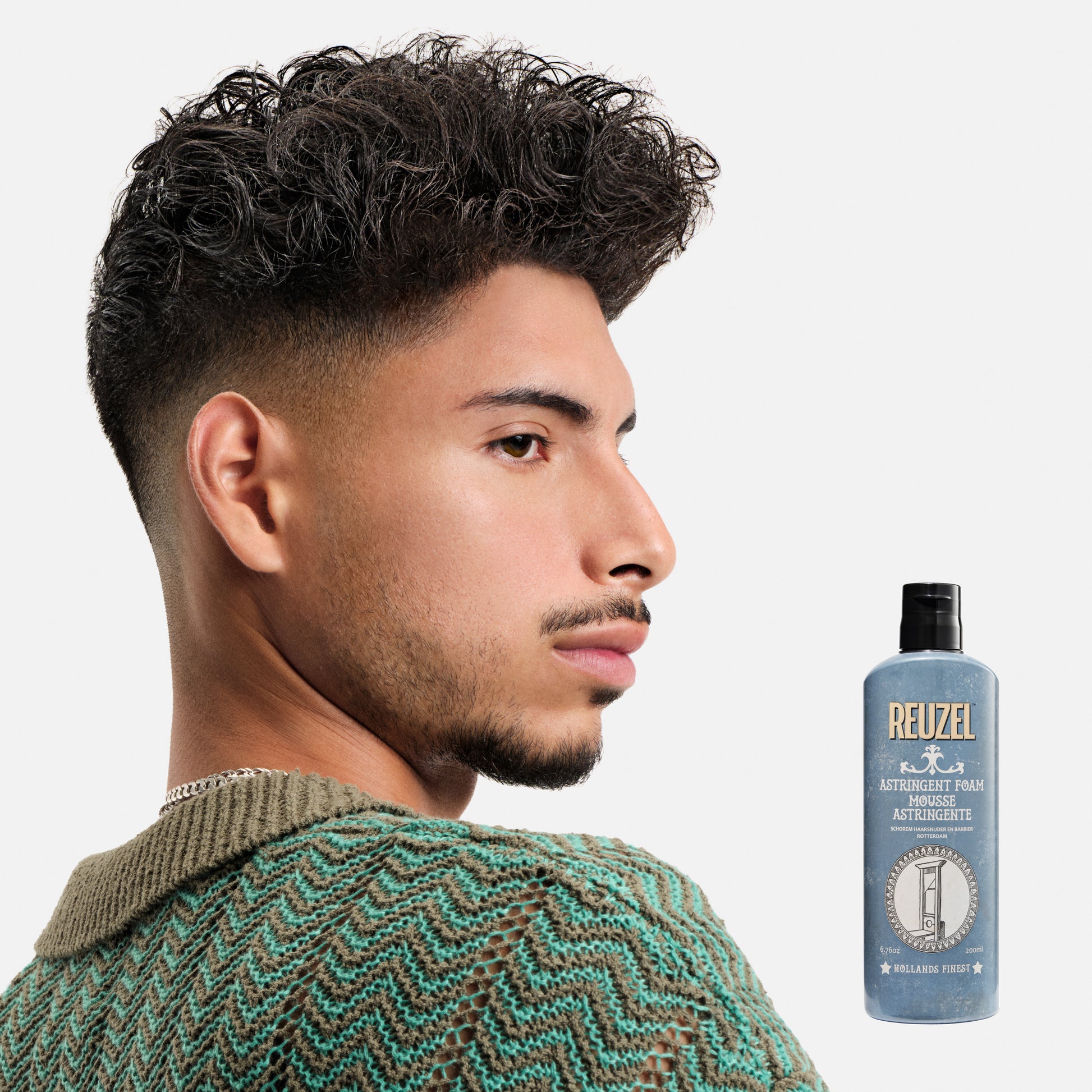 Reuzel Astringent Foam beard grooming product in a pump bottle, designed for cleansing and tightening beard skin.