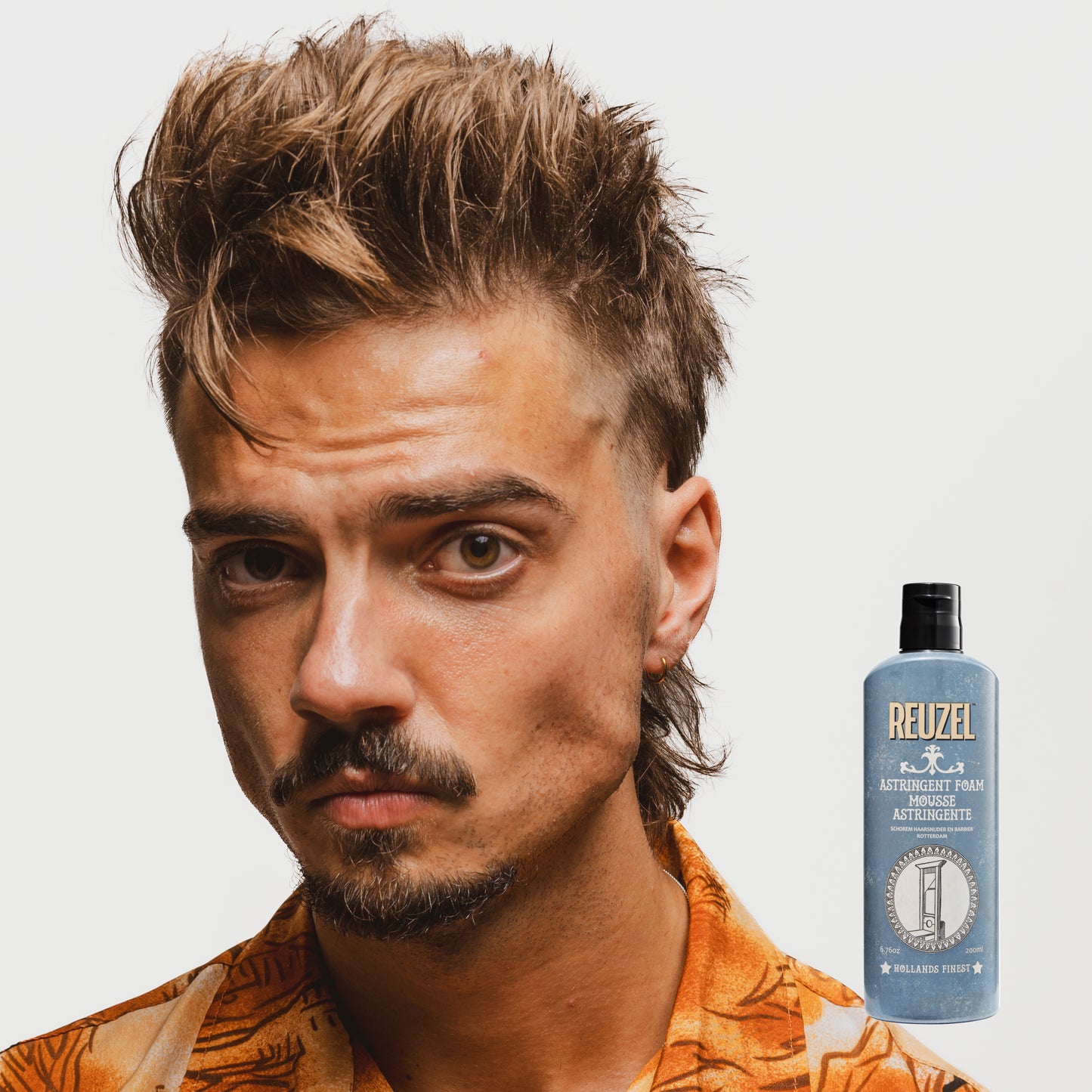 Reuzel Astringent Foam beard grooming product in a tube, designed for refreshing and tightening skin after shaving.