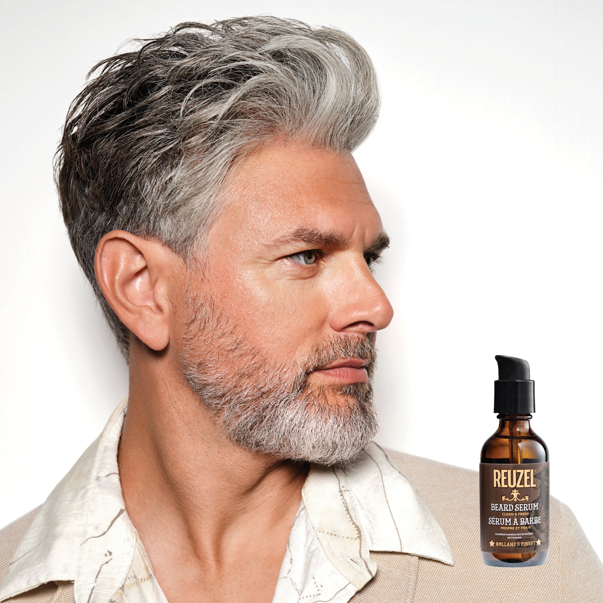 Reuzel beard oil in a dropper bottle, featuring a clean and fresh beard serum for softening and nourishing facial hair.