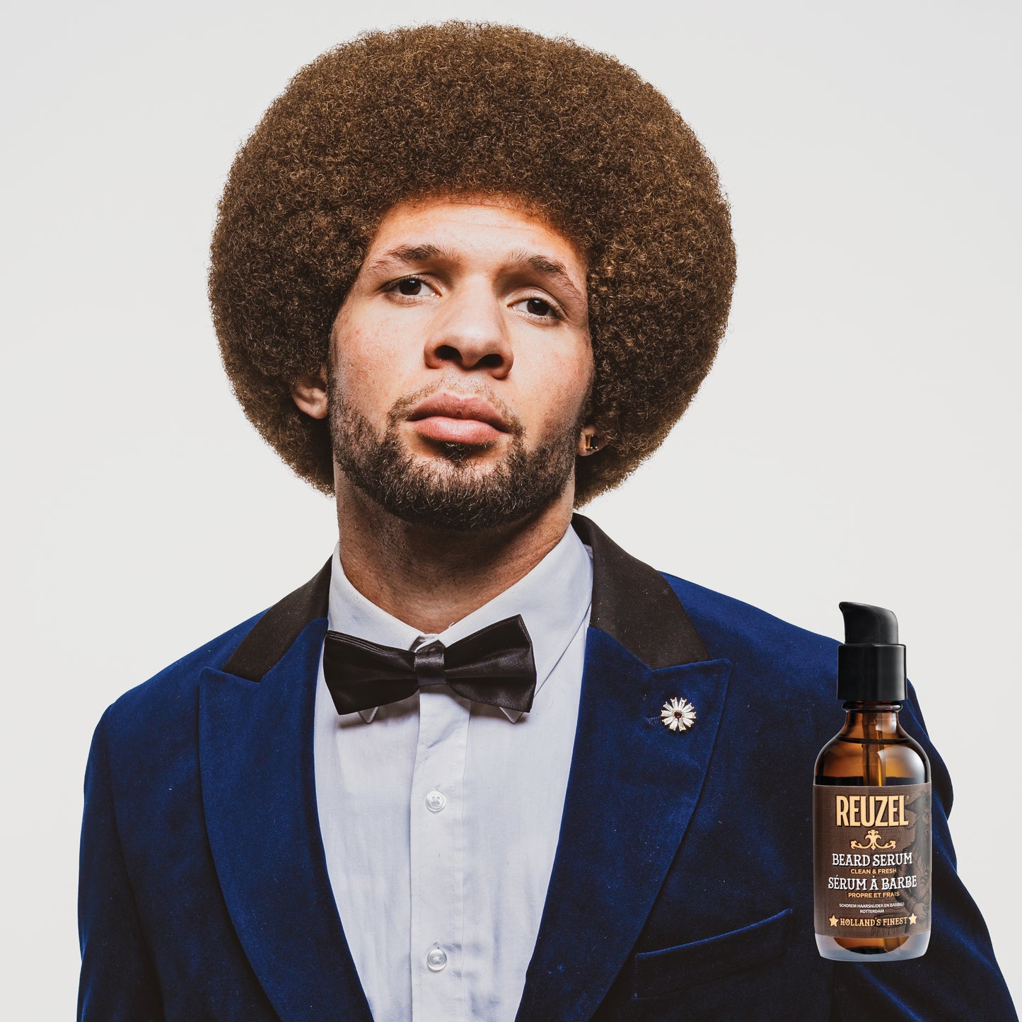 Reuzel Beard Oil clean and fresh beard serum in a dropper bottle, ideal for softening and moisturizing facial hair.