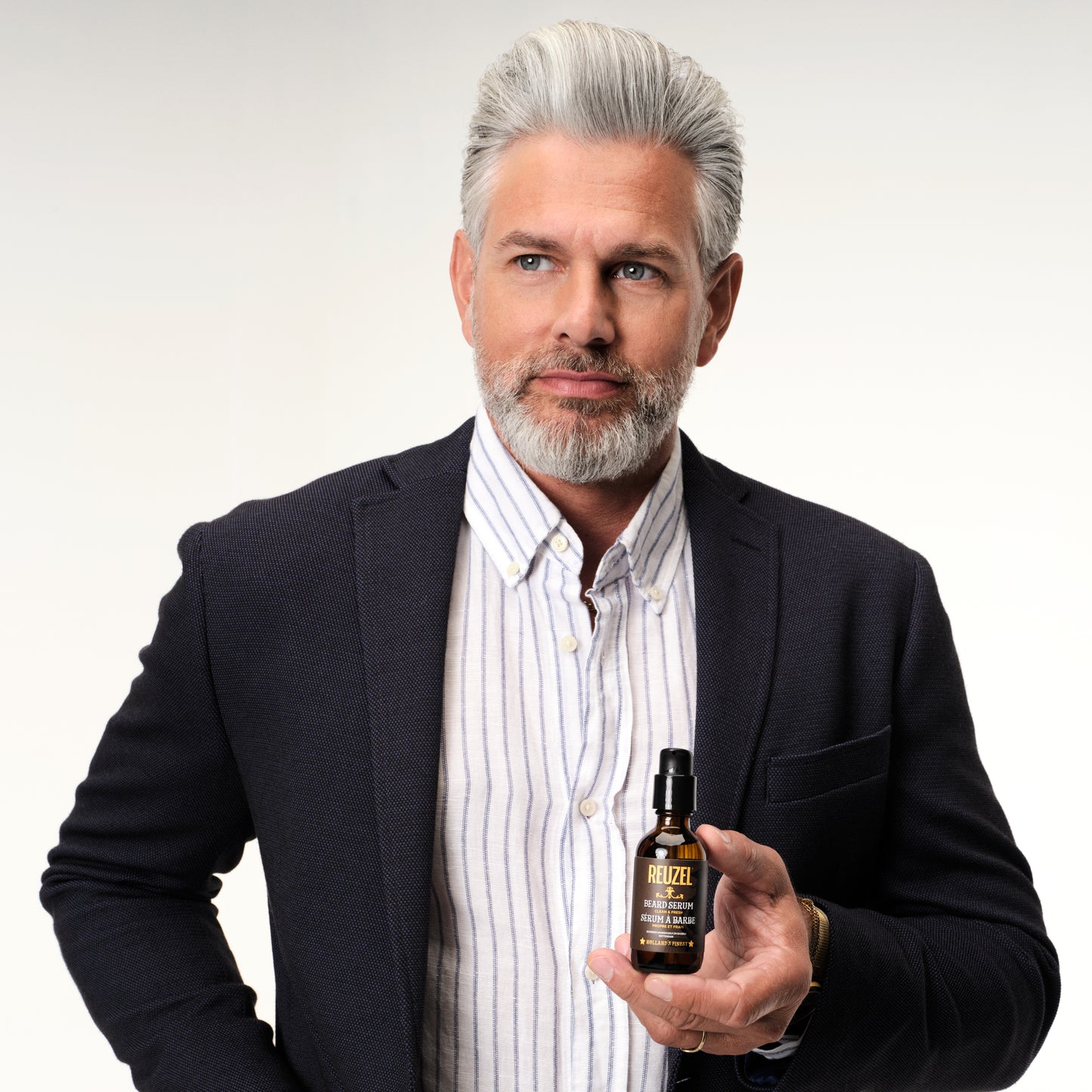 Reuzel beard oil and serum with a clean, fresh scent, designed to hydrate and soften facial hair and skin.