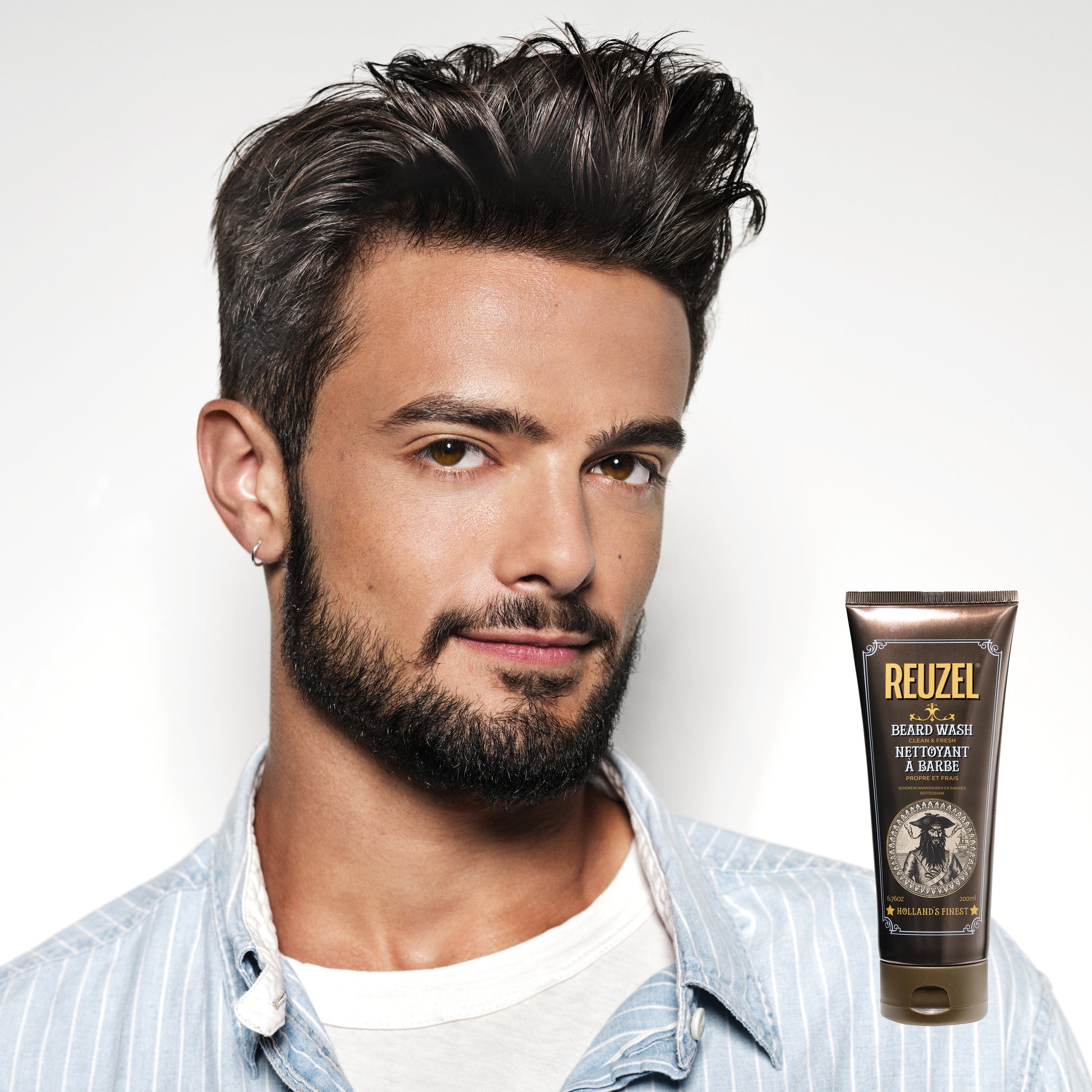 Reuzel Clean & Fresh Beard Wash in a clear bottle with label, designed for beard cleansing and grooming.