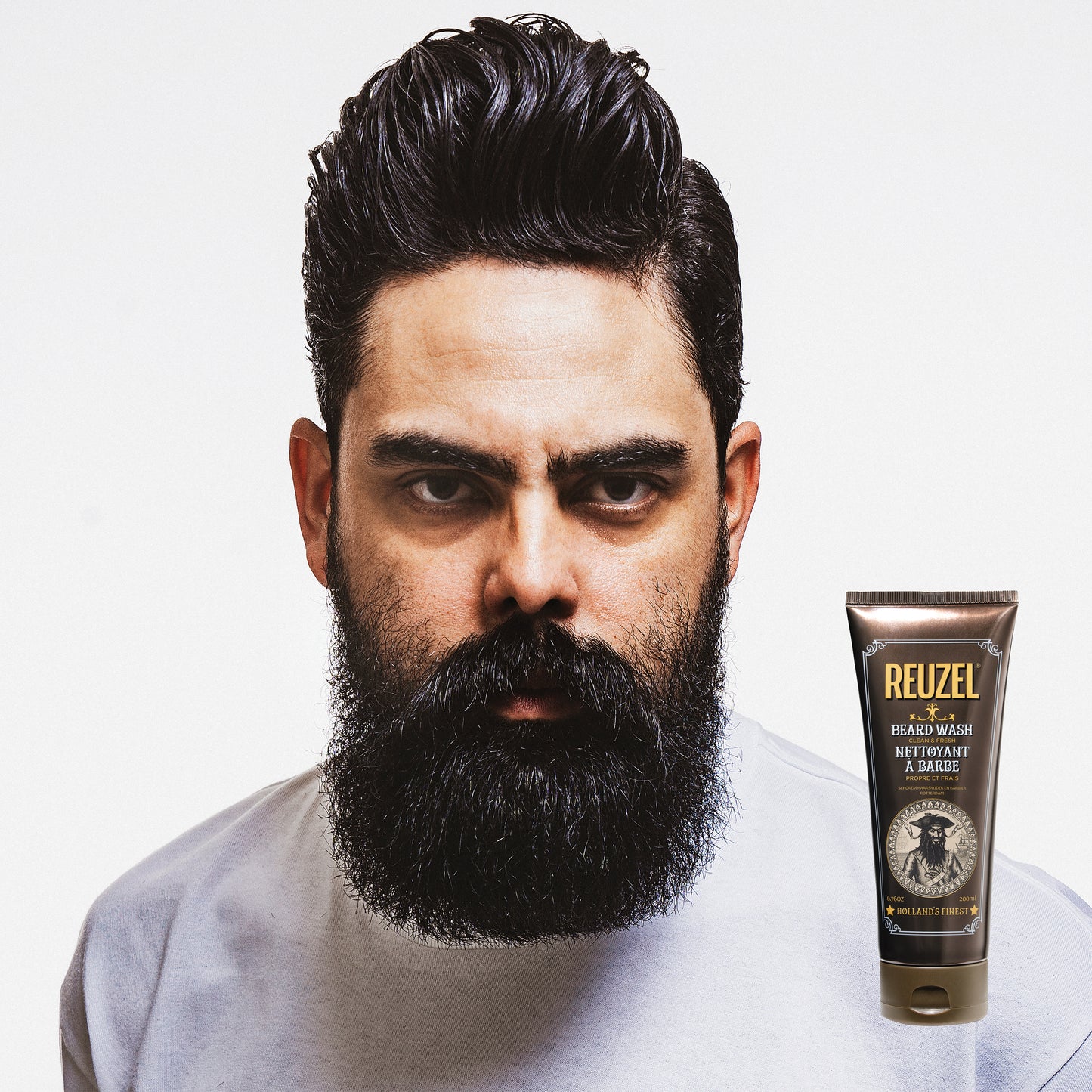 Reuzel Clean & Fresh Beard Wash in a clear bottle with a pump, showing the product label and a clean, fresh appearance.