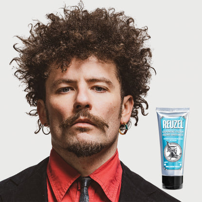Reuzel grooming cream in a jar, showcasing the hair styling product with a smooth, creamy texture for styling and hold.