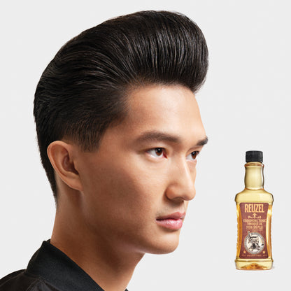 Reuzel Grooming Tonic hair tonic bottle with label, clear liquid inside, designed for styling and hair care.