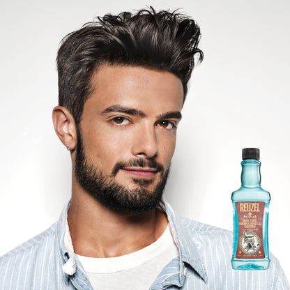 Reuzel Hair Tonic bottle with label, showcasing the product designed to promote healthy hair and scalp.