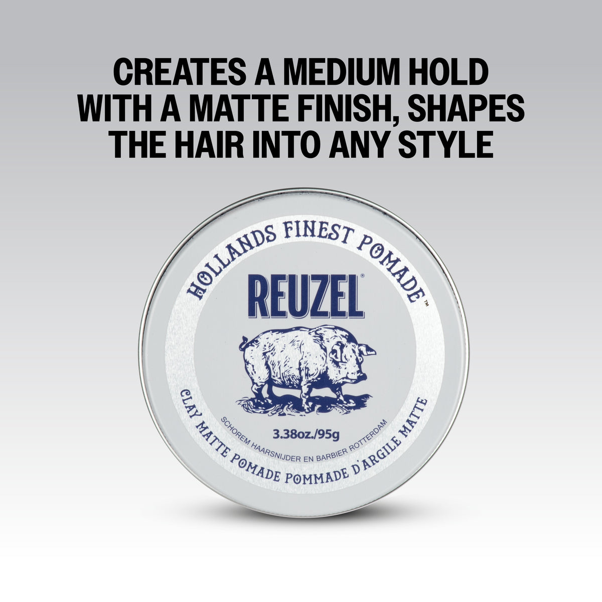 Reuzel Road Trip To Go Clay Pomade jar with black lid and label, showing the product container for styling hair.