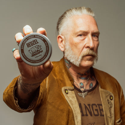 Reuzel Concrete Hold Matte Pomade jar with black and gray packaging, showcasing the product label and lid.