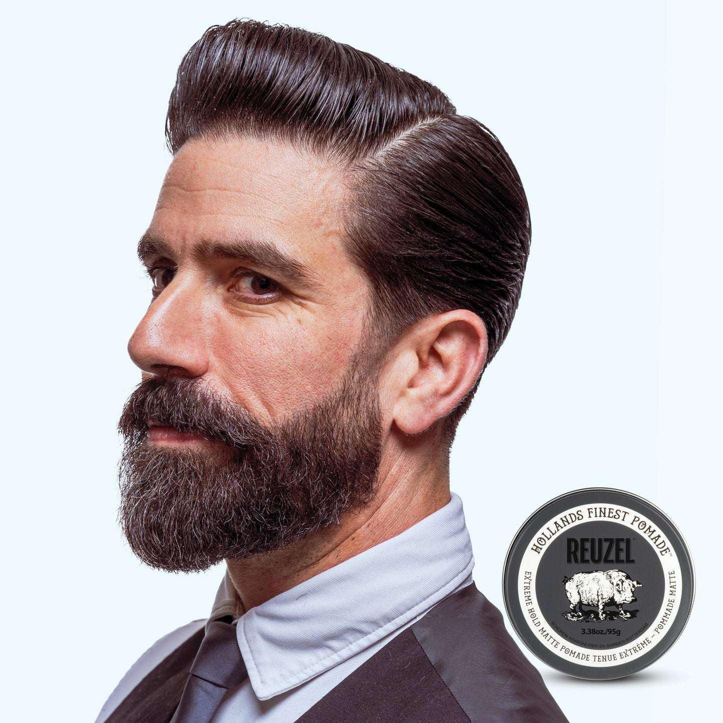 Reuzel Road Trip To Go Extreme Hold Matte Pomade jar with black lid and label, ideal for strong matte hair styling.
