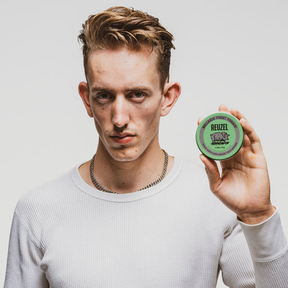 Reuzel Green Pomade grease jar with a label, showcasing the vibrant green container and classic branding for styling hair.