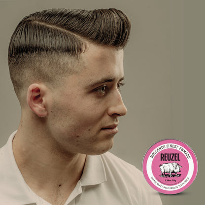 Pink Reuzel Pomade Grease jar with label, showcasing vibrant packaging and product details for classic hair styling.