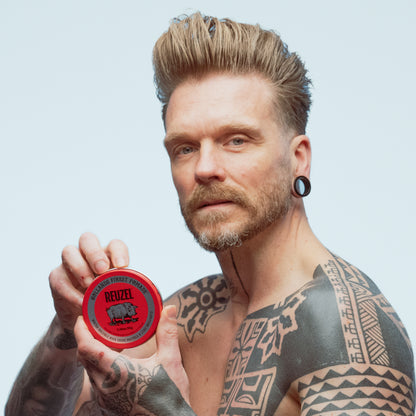 Reuzel Road Trip To Go Red Pomade in a jar, showcasing vibrant red pomade for styling hair with a classic look.