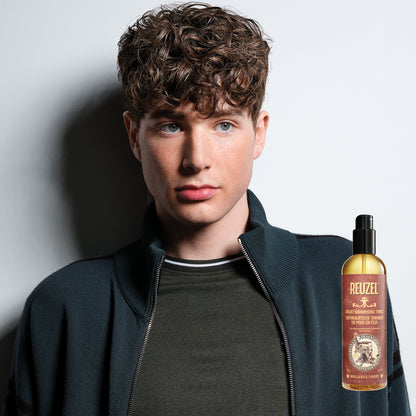 Reuzel Spray Grooming Tonic hair tonic in a spray bottle, designed to refresh and style hair.