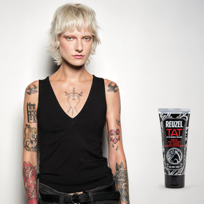 Reuzel TAT Vivid Gel tattoo aftercare product in a clear jar, showcasing its vibrant gel texture and branding.