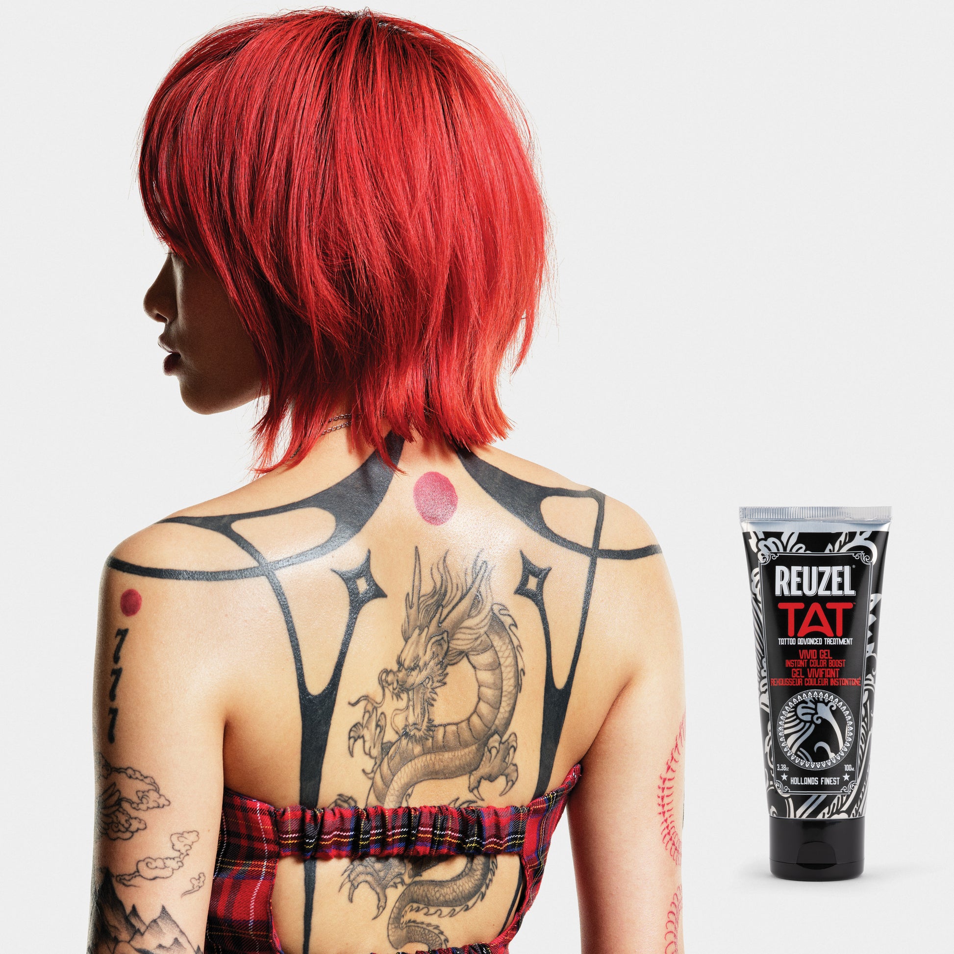 Reuzel TAT Vivid Gel tattoo aftercare product in a clear jar, showing the vibrant gel inside.