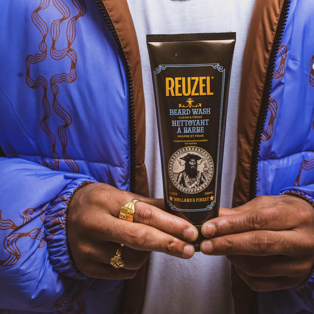 Reuzel Clean & Fresh Beard Wash in a clear bottle with a pump, designed for cleansing and refreshing men's beard grooming.