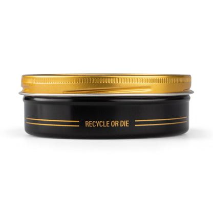 Reuzel x Liquid Death Severed Head Pomade jar with label, showcasing the unique branding and packaging of this hair styling product.