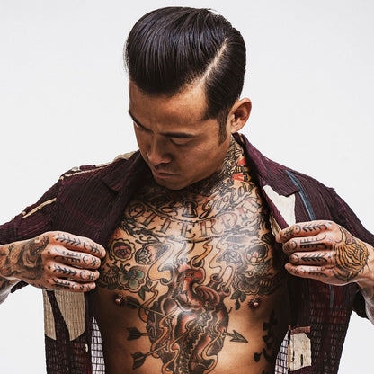 Reuzel TAT Hydrabalm tattoo aftercare product in a sleek jar, designed to moisturize and protect fresh tattoos.