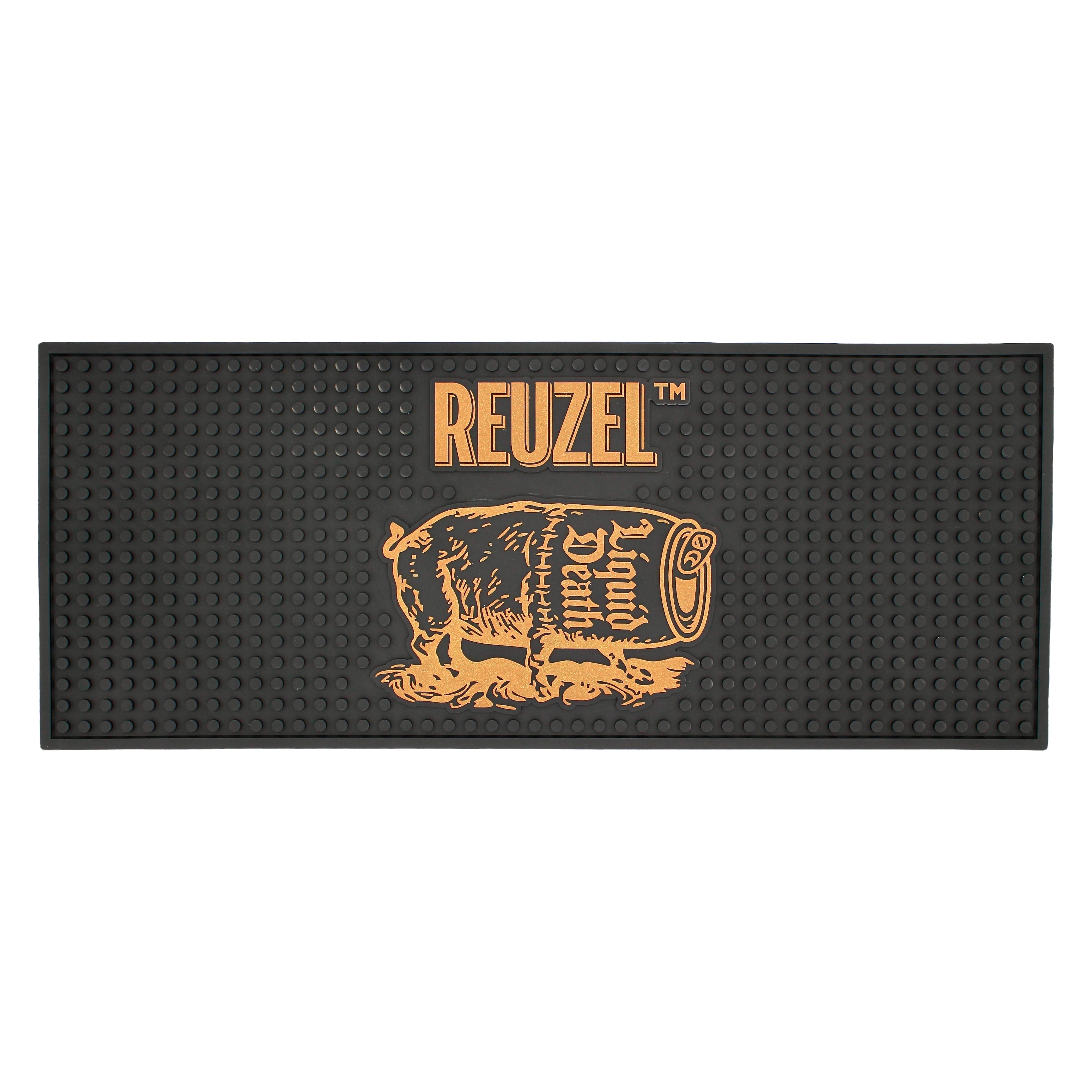 Reuzel Liquid Death barber mat featuring a severed head design, made by REUZEL UK for professional grooming and barber use.